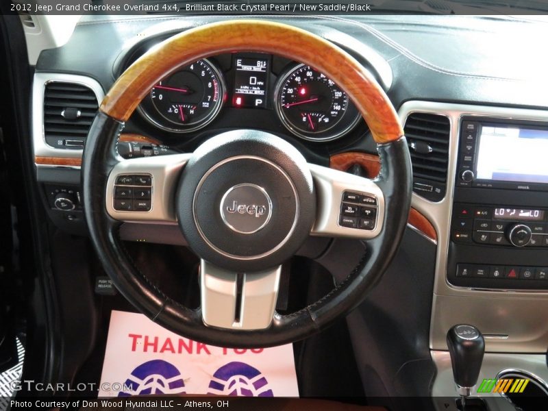Brilliant Black Crystal Pearl / New Saddle/Black 2012 Jeep Grand Cherokee Overland 4x4