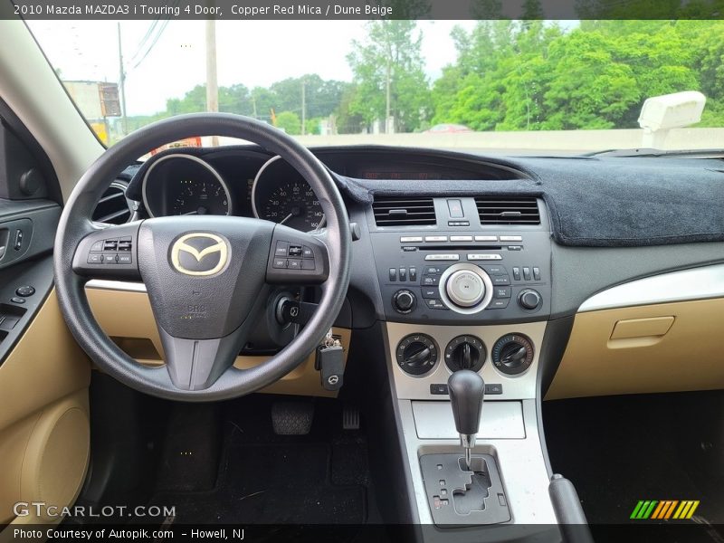 Copper Red Mica / Dune Beige 2010 Mazda MAZDA3 i Touring 4 Door