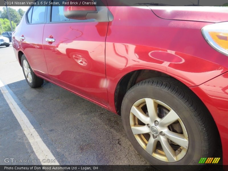 Red Brick / Charcoal 2014 Nissan Versa 1.6 SV Sedan