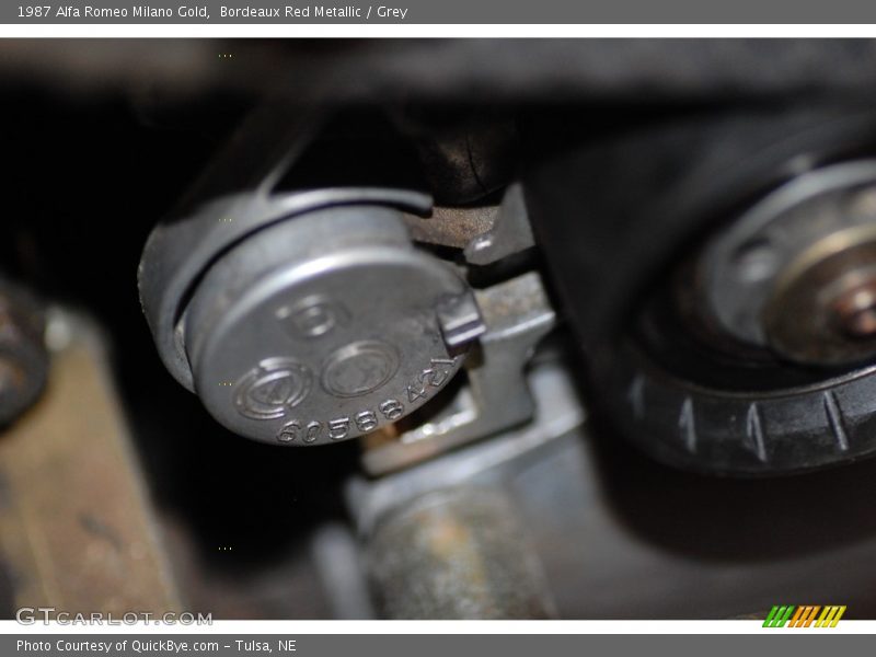 Bordeaux Red Metallic / Grey 1987 Alfa Romeo Milano Gold
