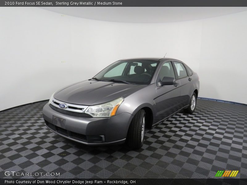 Sterling Grey Metallic / Medium Stone 2010 Ford Focus SE Sedan