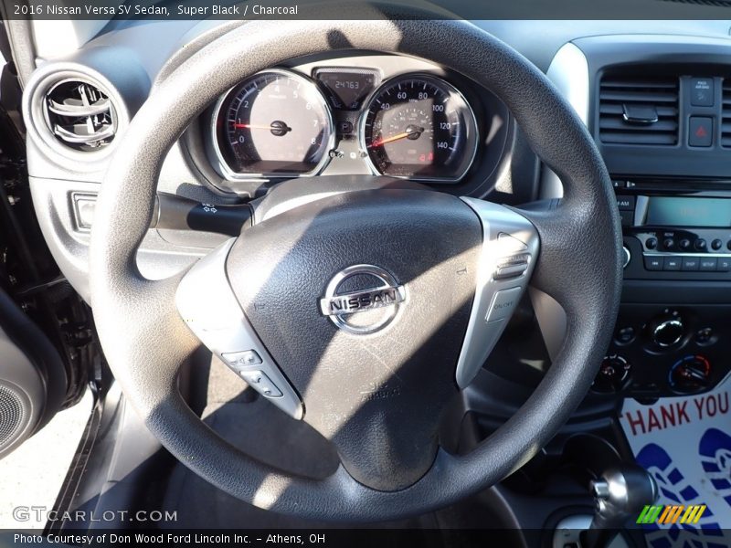 Super Black / Charcoal 2016 Nissan Versa SV Sedan
