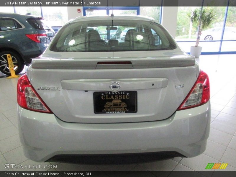 Brilliant Silver Metallic / Charcoal 2019 Nissan Versa SV
