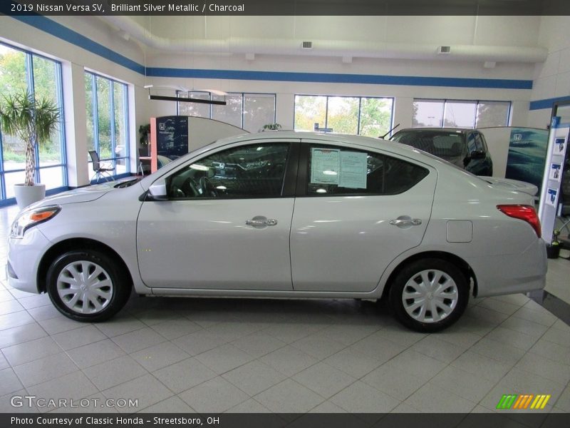 Brilliant Silver Metallic / Charcoal 2019 Nissan Versa SV