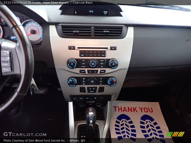 Ingot Silver Metallic / Charcoal Black 2010 Ford Focus SE Sedan