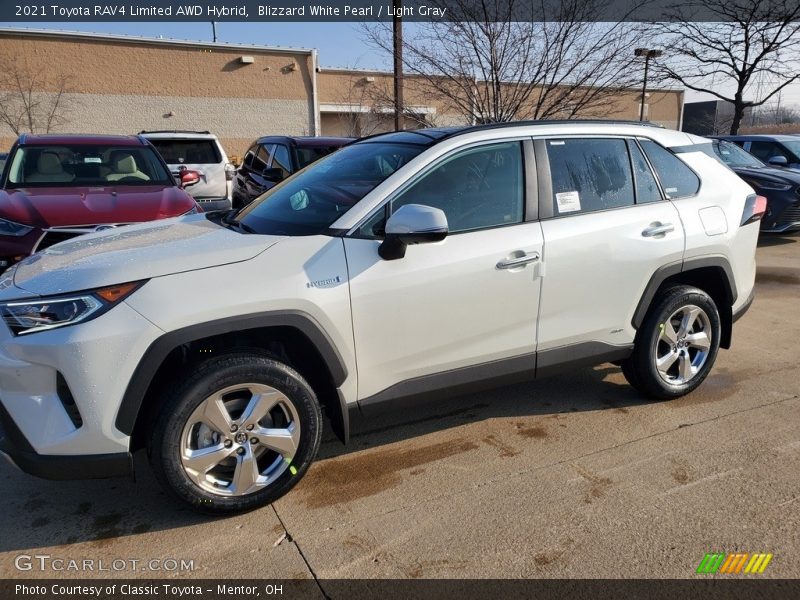 Blizzard White Pearl / Light Gray 2021 Toyota RAV4 Limited AWD Hybrid