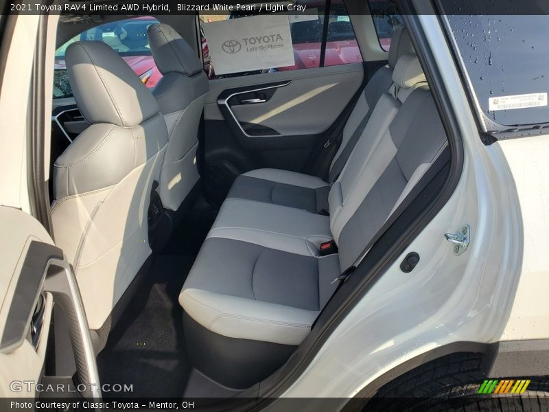 Blizzard White Pearl / Light Gray 2021 Toyota RAV4 Limited AWD Hybrid