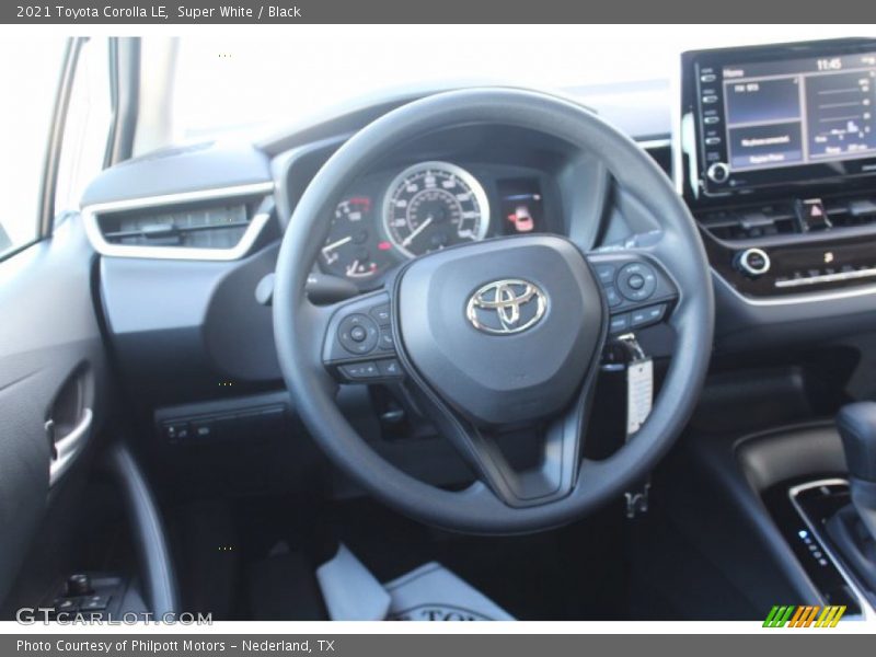 Super White / Black 2021 Toyota Corolla LE