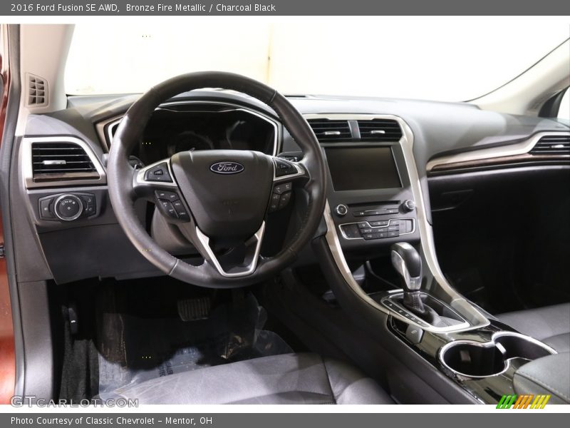 Bronze Fire Metallic / Charcoal Black 2016 Ford Fusion SE AWD