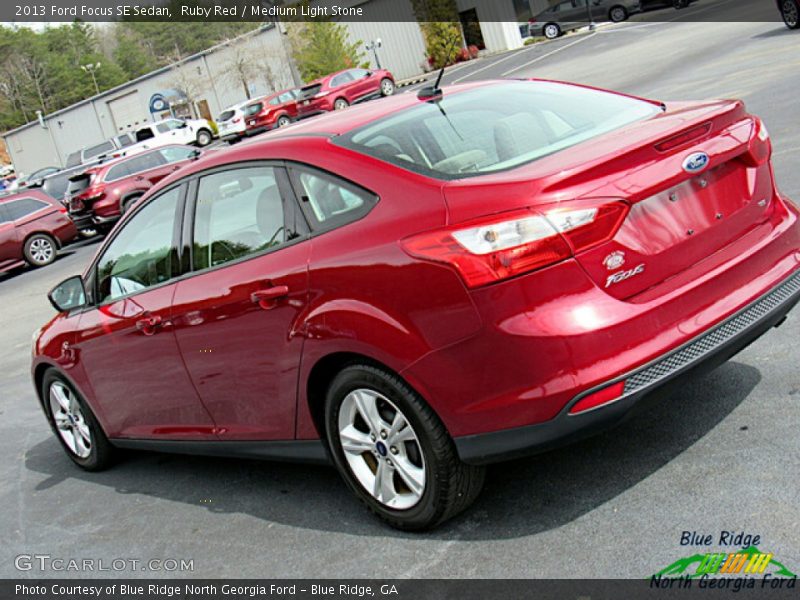 Ruby Red / Medium Light Stone 2013 Ford Focus SE Sedan
