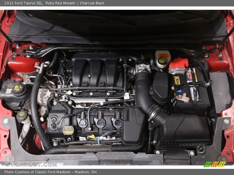 Ruby Red Metallic / Charcoal Black 2013 Ford Taurus SEL