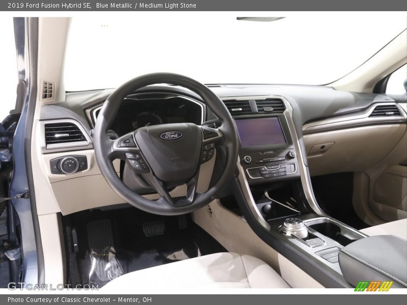 Blue Metallic / Medium Light Stone 2019 Ford Fusion Hybrid SE