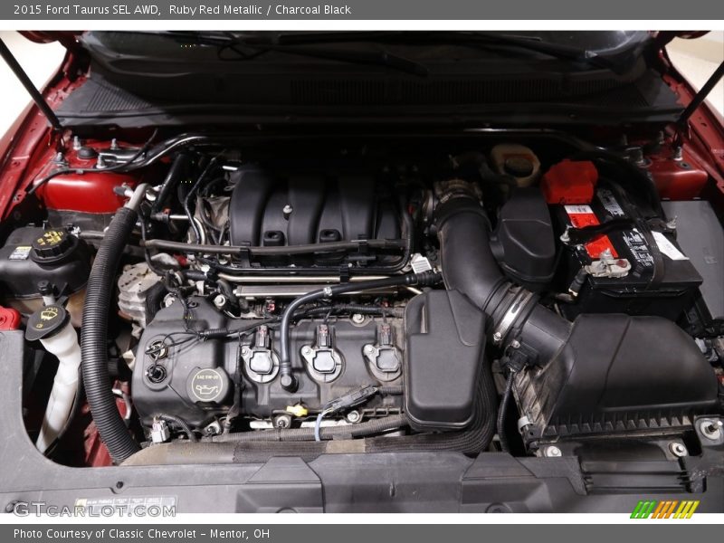 Ruby Red Metallic / Charcoal Black 2015 Ford Taurus SEL AWD