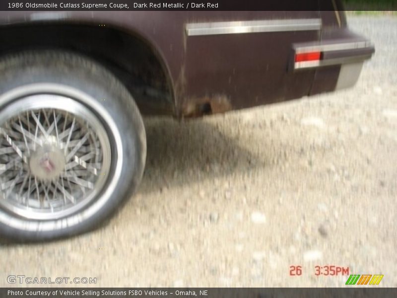 Dark Red Metallic / Dark Red 1986 Oldsmobile Cutlass Supreme Coupe