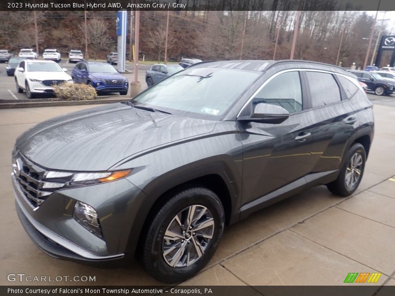 Front 3/4 View of 2023 Tucson Blue Hybrid AWD