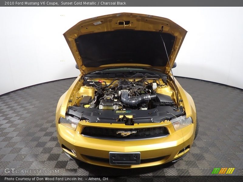Sunset Gold Metallic / Charcoal Black 2010 Ford Mustang V6 Coupe