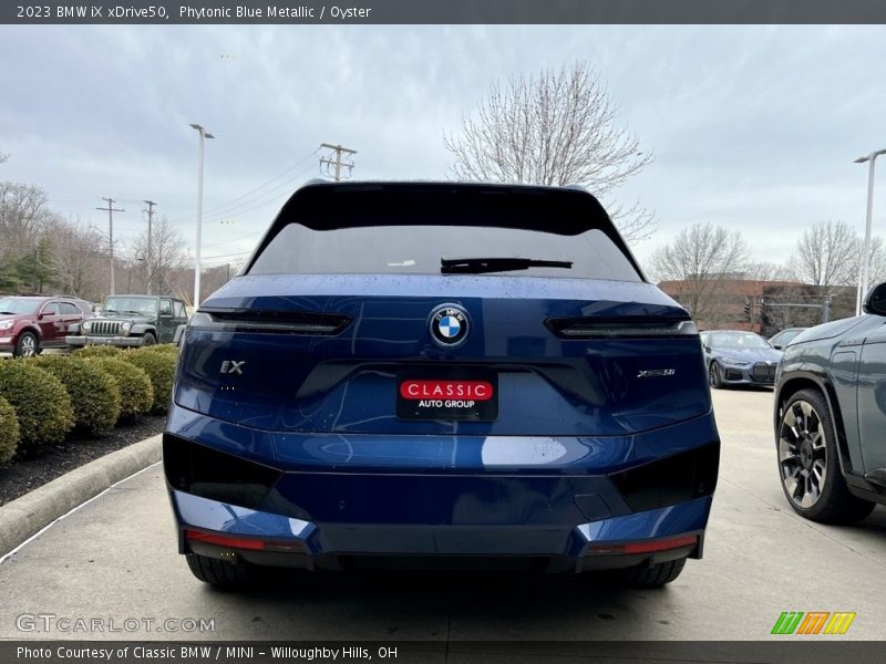 Phytonic Blue Metallic / Oyster 2023 BMW iX xDrive50