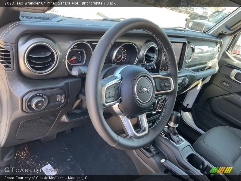 Bright White / Black 2023 Jeep Wrangler Unlimited Sahara 4x4