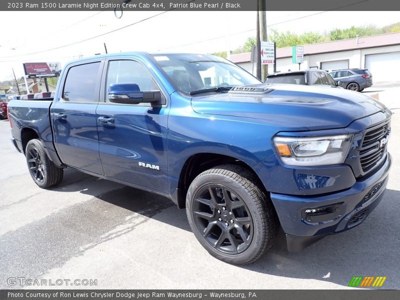 Front 3/4 View of 2023 1500 Laramie Night Edition Crew Cab 4x4