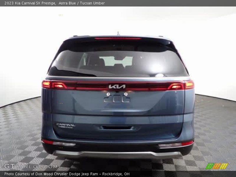 Astra Blue / Tucsan Umber 2023 Kia Carnival SX Prestige