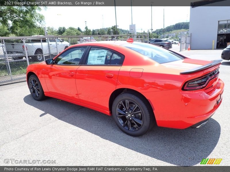 Go Mango / Black 2023 Dodge Charger SXT AWD Blacktop