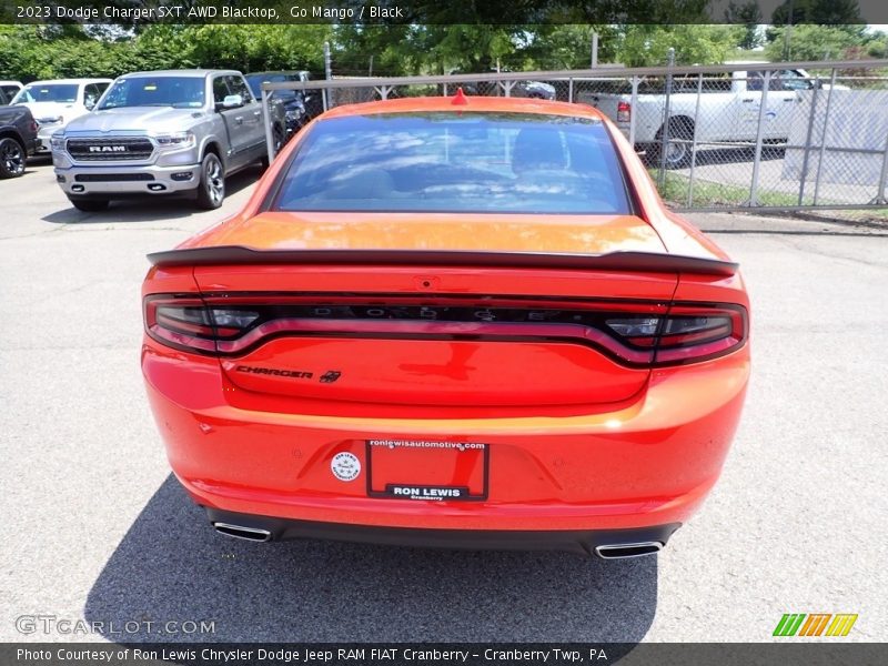 Go Mango / Black 2023 Dodge Charger SXT AWD Blacktop