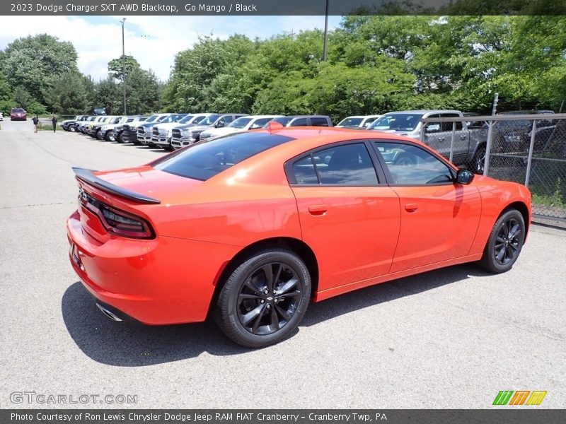 Go Mango / Black 2023 Dodge Charger SXT AWD Blacktop
