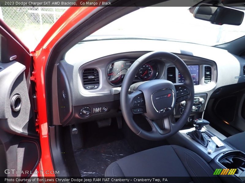 Go Mango / Black 2023 Dodge Charger SXT AWD Blacktop