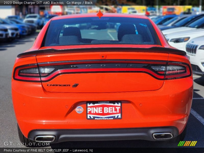 Go Mango / Black 2023 Dodge Charger SXT AWD Blacktop