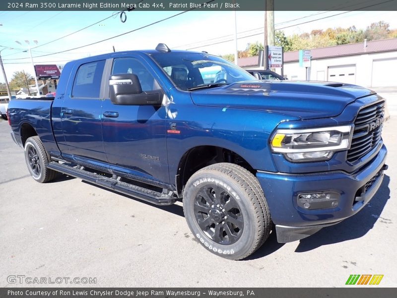 Front 3/4 View of 2024 3500 Laramie Night Edition Mega Cab 4x4