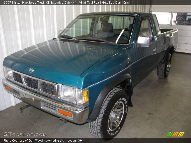 Vivid Teal Pearl Metallic / Dark Gray 1997 Nissan Hardbody Truck XE Extended Cab 4x4