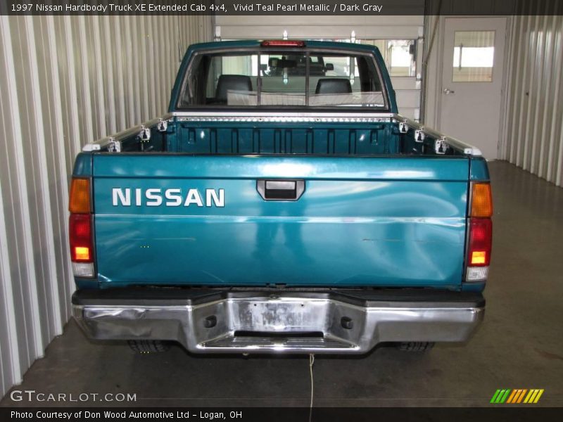 Vivid Teal Pearl Metallic / Dark Gray 1997 Nissan Hardbody Truck XE Extended Cab 4x4