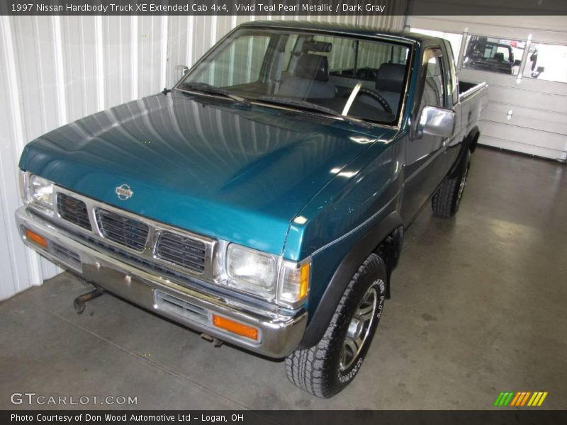 Vivid Teal Pearl Metallic / Dark Gray 1997 Nissan Hardbody Truck XE Extended Cab 4x4