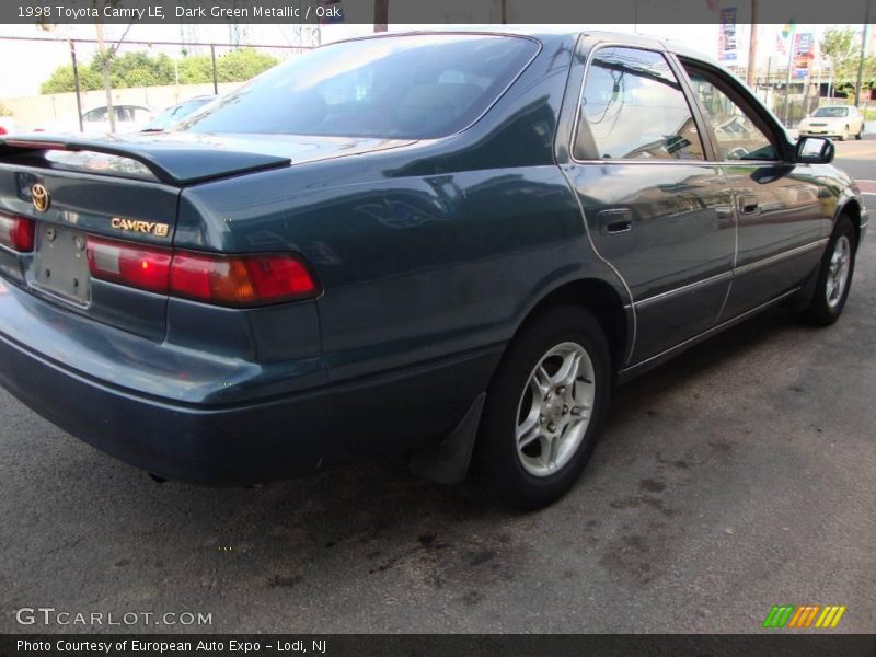 Dark Green Metallic / Oak 1998 Toyota Camry LE