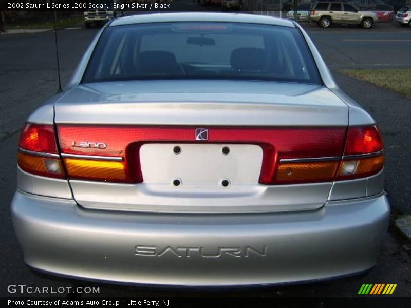 Bright Silver / Black 2002 Saturn L Series L200 Sedan