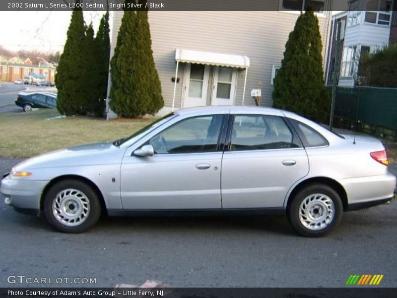 Bright Silver / Black 2002 Saturn L Series L200 Sedan