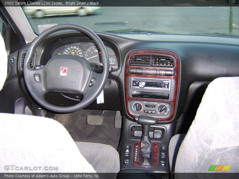 Bright Silver / Black 2002 Saturn L Series L200 Sedan