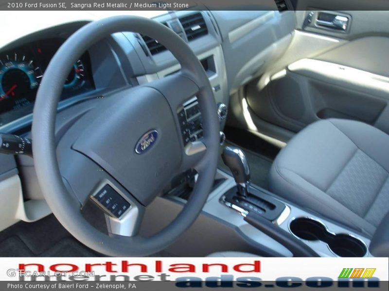 Sangria Red Metallic / Medium Light Stone 2010 Ford Fusion SE