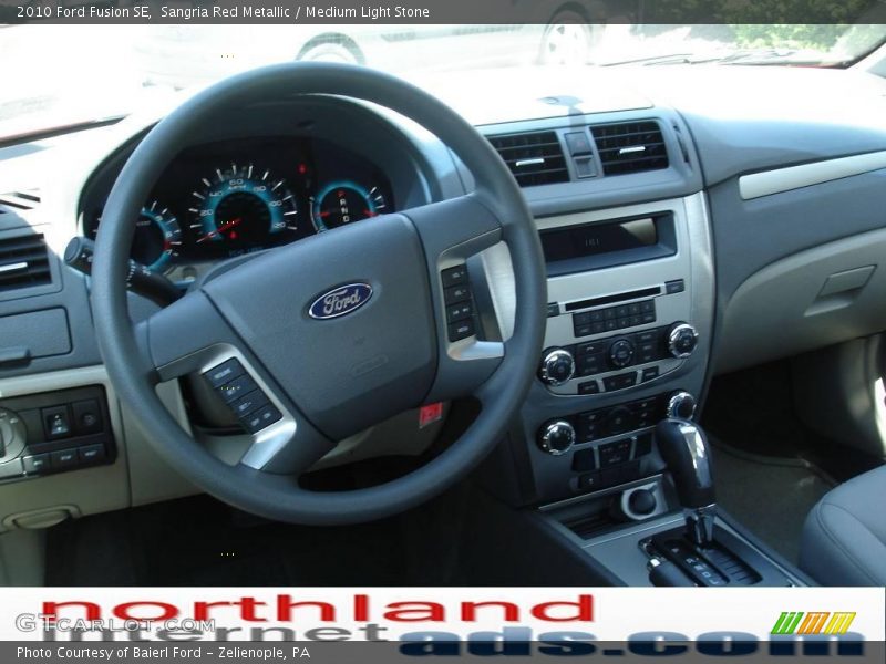 Sangria Red Metallic / Medium Light Stone 2010 Ford Fusion SE