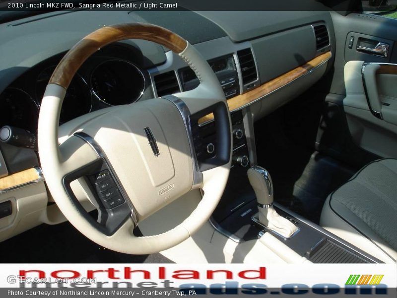Sangria Red Metallic / Light Camel 2010 Lincoln MKZ FWD
