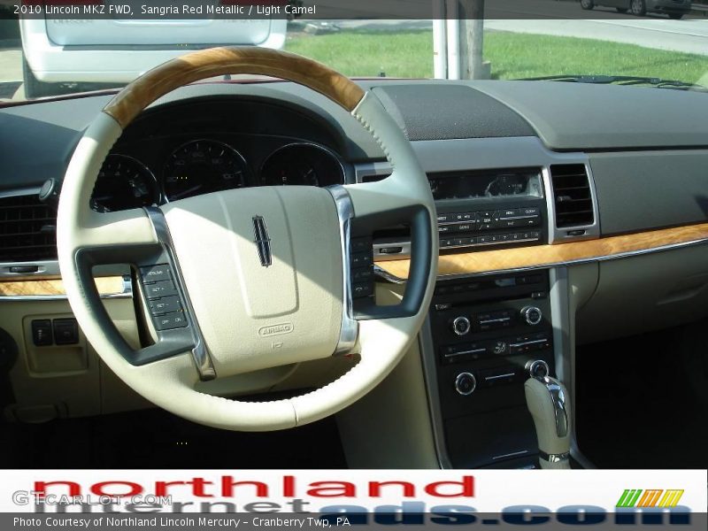 Sangria Red Metallic / Light Camel 2010 Lincoln MKZ FWD