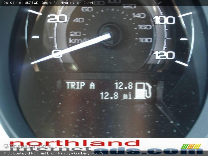 Sangria Red Metallic / Light Camel 2010 Lincoln MKZ FWD