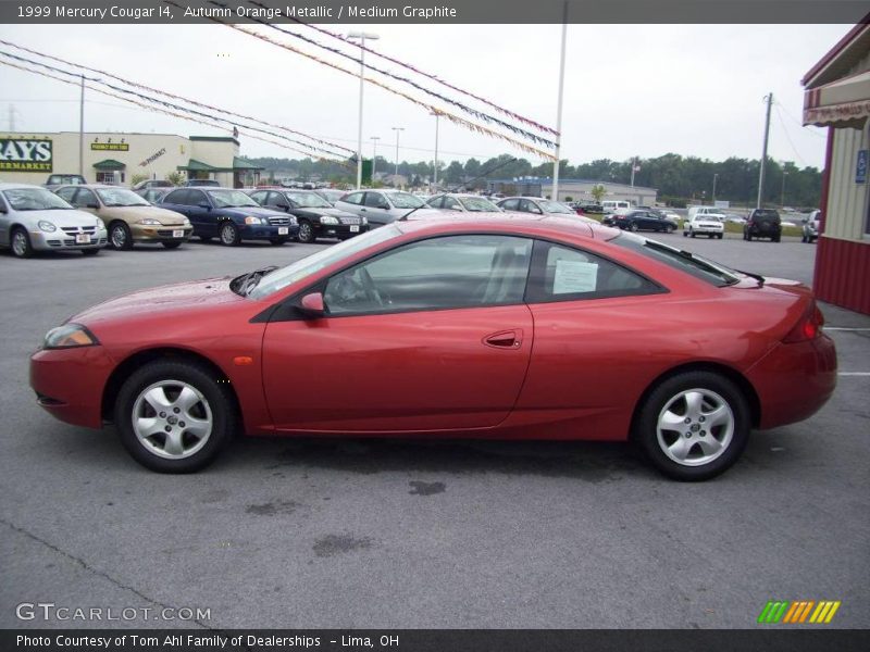 Autumn Orange Metallic / Medium Graphite 1999 Mercury Cougar I4