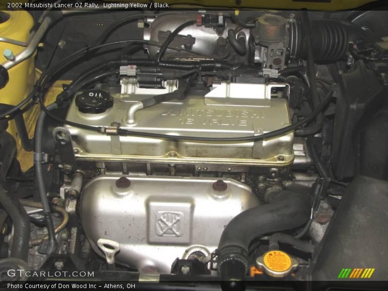 Lightning Yellow / Black 2002 Mitsubishi Lancer OZ Rally