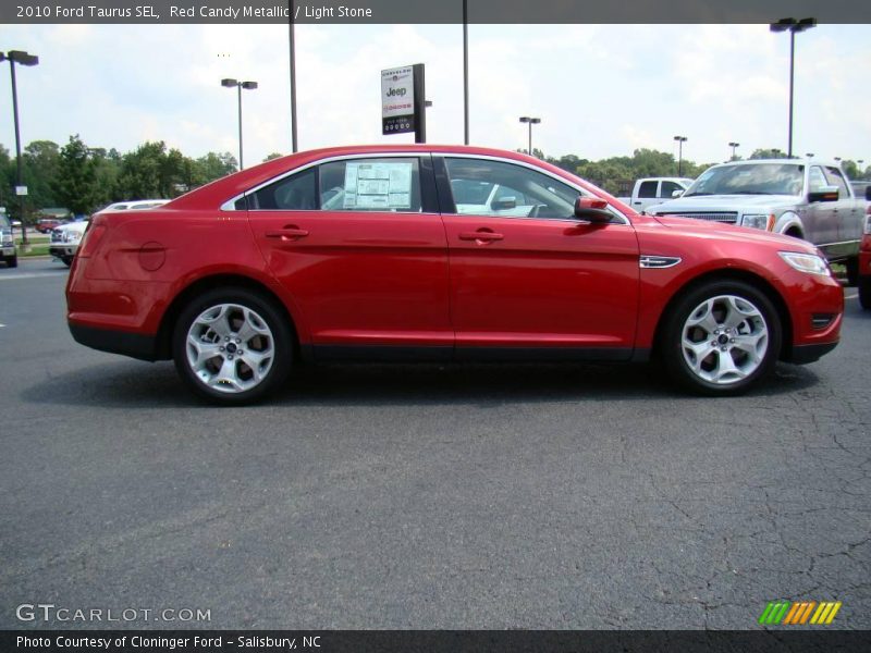 Red Candy Metallic / Light Stone 2010 Ford Taurus SEL
