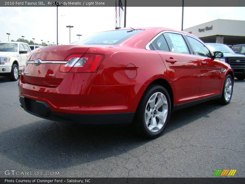 Red Candy Metallic / Light Stone 2010 Ford Taurus SEL