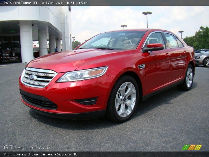 Red Candy Metallic / Light Stone 2010 Ford Taurus SEL