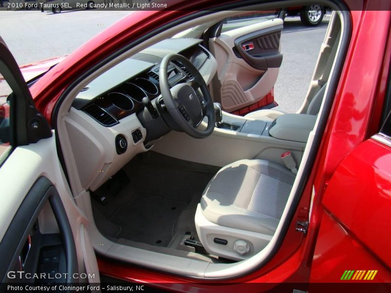 Red Candy Metallic / Light Stone 2010 Ford Taurus SEL