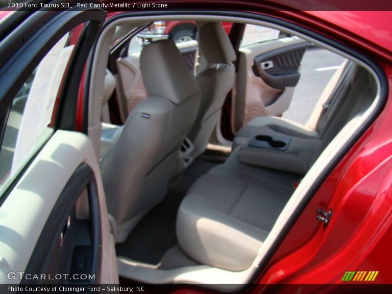 Red Candy Metallic / Light Stone 2010 Ford Taurus SEL