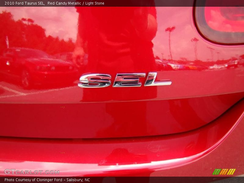 Red Candy Metallic / Light Stone 2010 Ford Taurus SEL